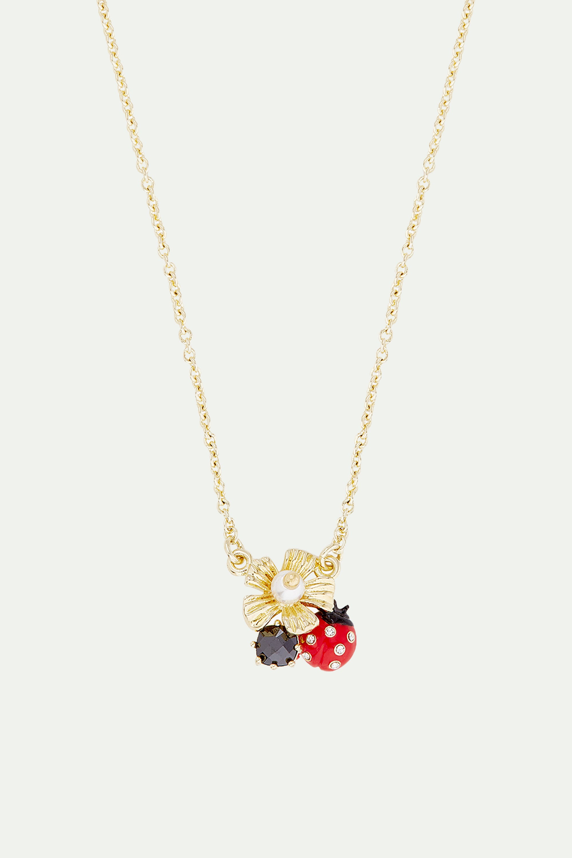 Collier pendentif coccinelle butinant une anémone et verre facetté