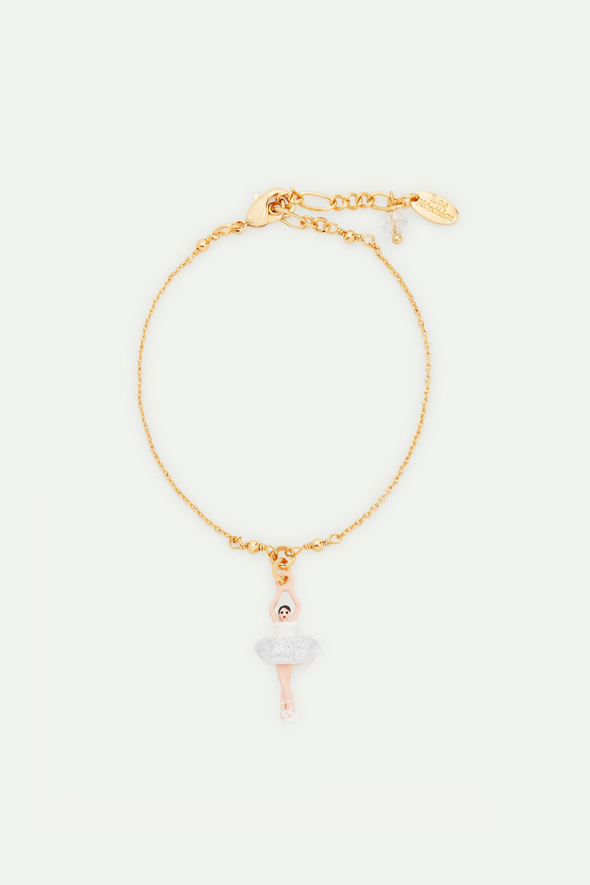 Pulsera fina bailarina con tutú blanco y lentejuelas plateadas