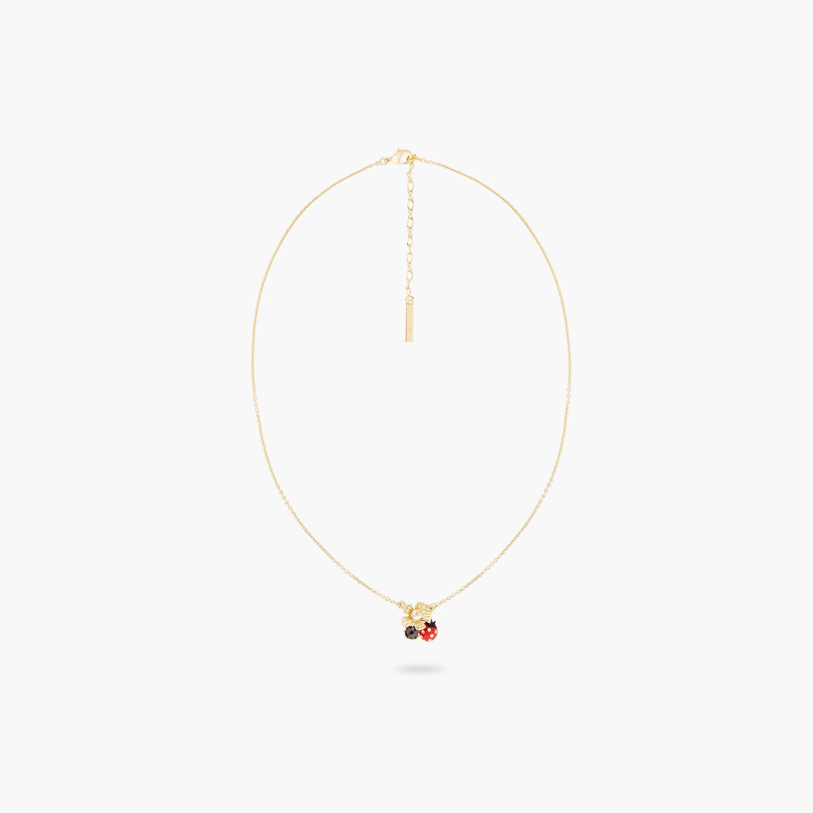 Collier pendentif coccinelle butinant une anémone et verre facetté