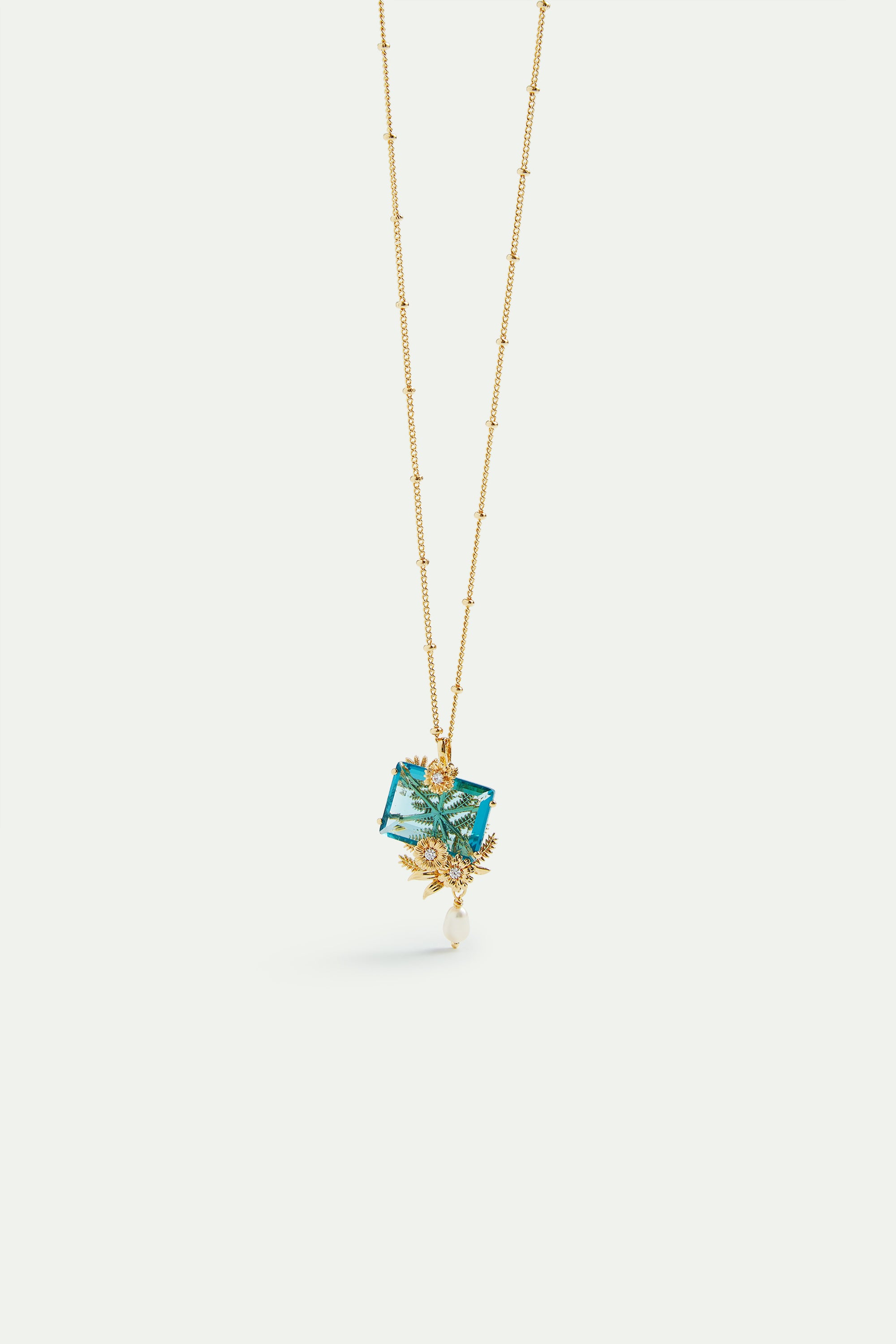 Blue cut stone, golden flowers and cultured pearl pendant necklace