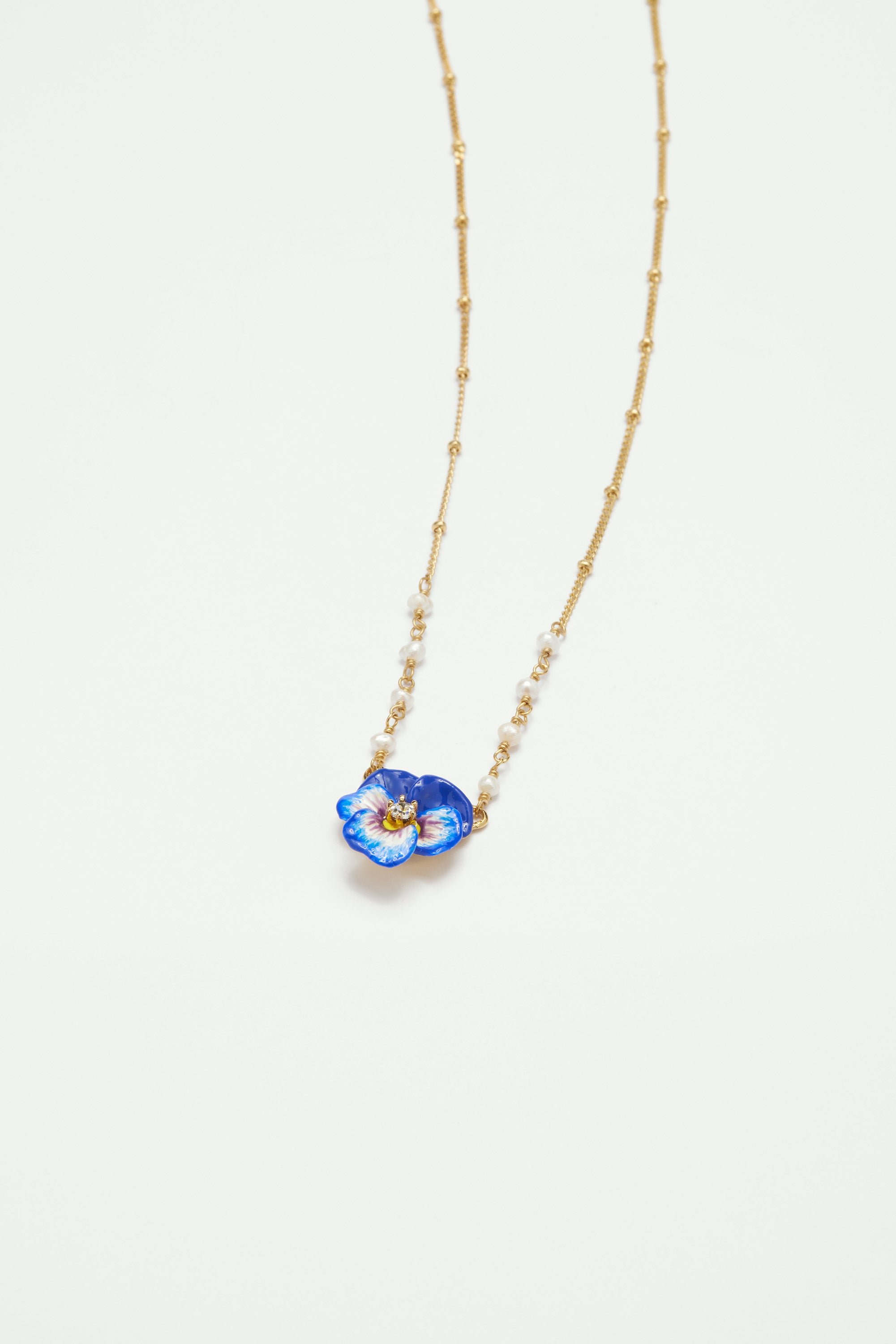 Blue pansy and faceted crystal pendant necklace