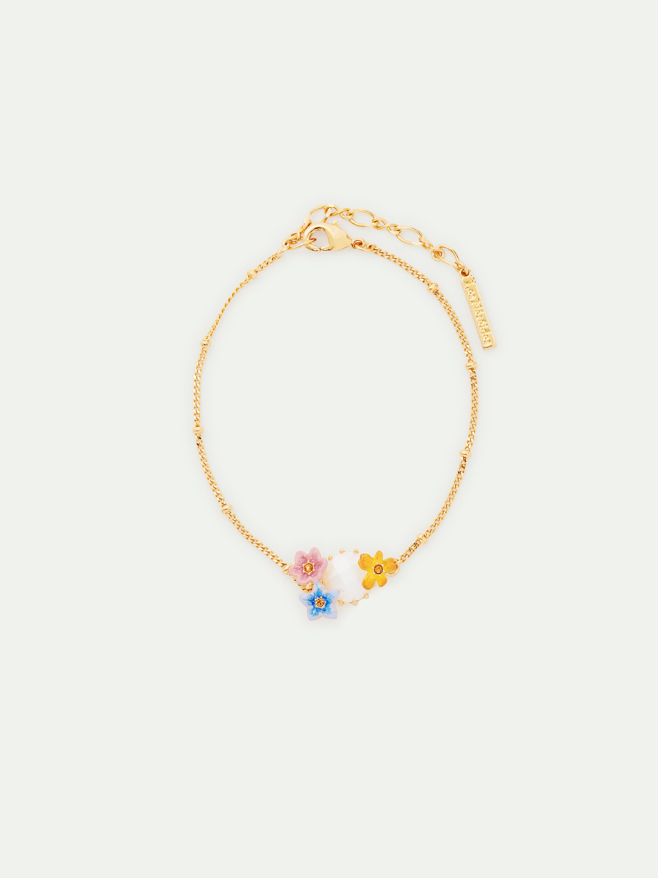 Pulsera fina de cristal facetado y 3 flores de jazmín de colores.